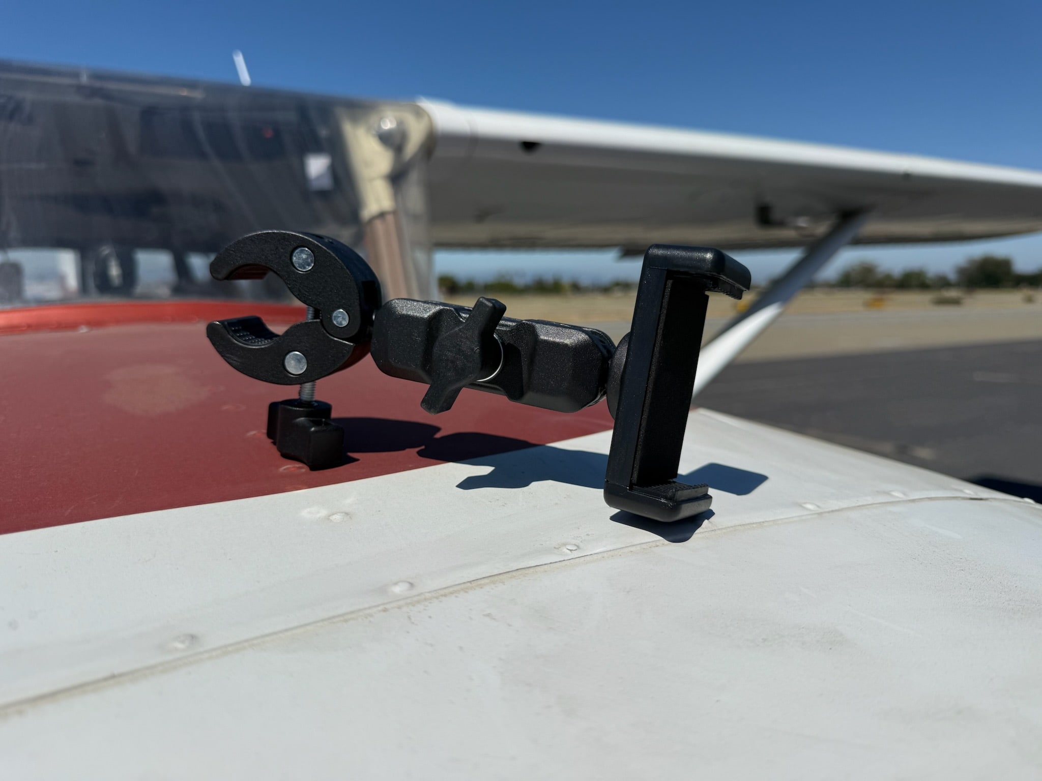 Yoke Clamp + Phone Holder, primary external view photographed outside the aircraft